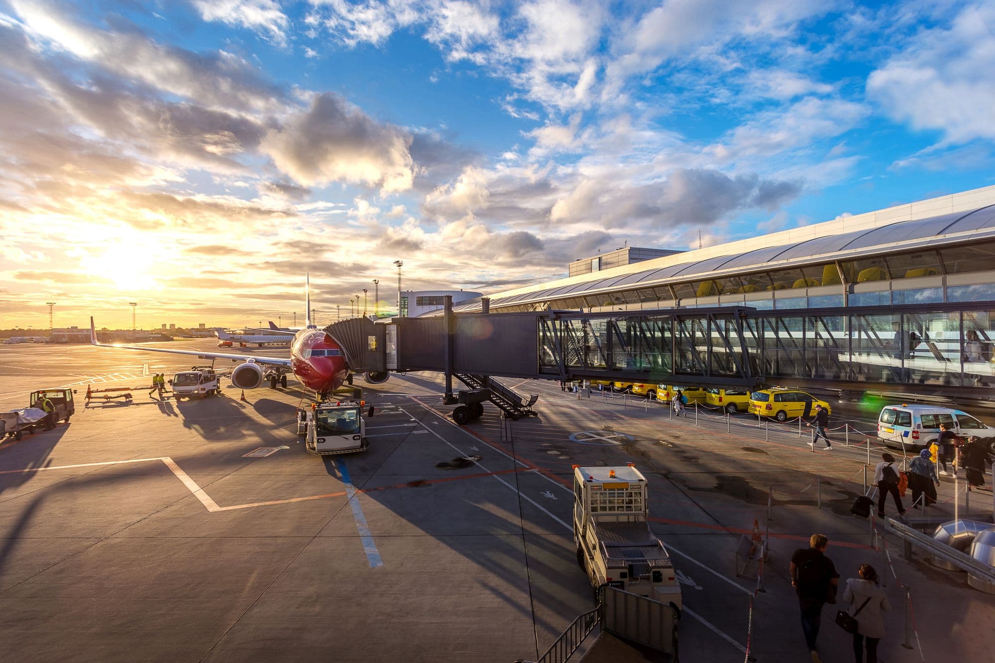 Aircraft and ground teams at an airport terminal